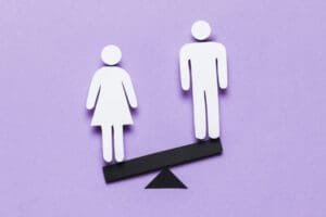 cartoon woman standing lower side seesaw